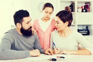 Married couple signing a Florida no-fault divorce agreement