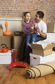 Divorced father and his daughter unpacking after a relocation