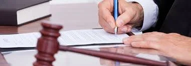 Judge signing a divorce modification document