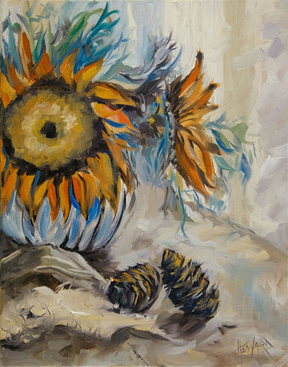 Still life with sunflowers and pine cones. 