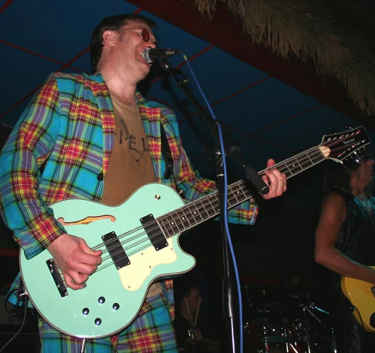 Ron Johnson on stage with his sea foam green Waterstone TP-2 12-string bass. The prize that Lily won was another 12-string bass for her dad!
