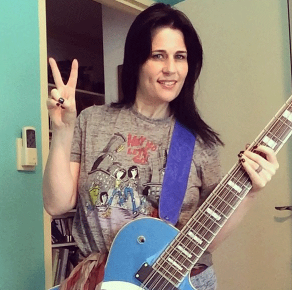 Stephanie plays a Waterstone TP-12/34 Blue Target 12-string bass. Rock on!