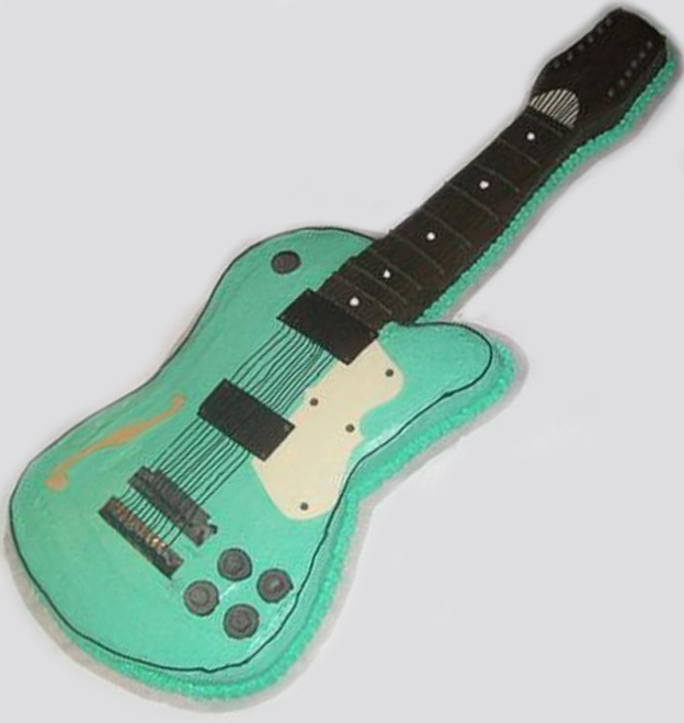 Ron Johnson celebrated a birthday with this nearly scale-sized Waterstone 12-string bass cake made by the staff at Spurgeon's Bay Bar & Grill in Dixon, Illinois. The knobs, bridge and pickups are made of chocolate.
