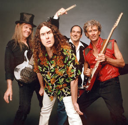 Another image from Weird Al Yankovic’s “Poodle Hat” album with Stephen Jay and with his Dean Rhapsody 12-string bass.