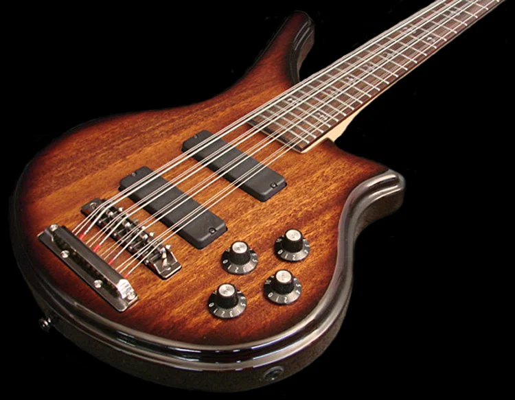 The standard plain black knobs on this bass have been replaced.