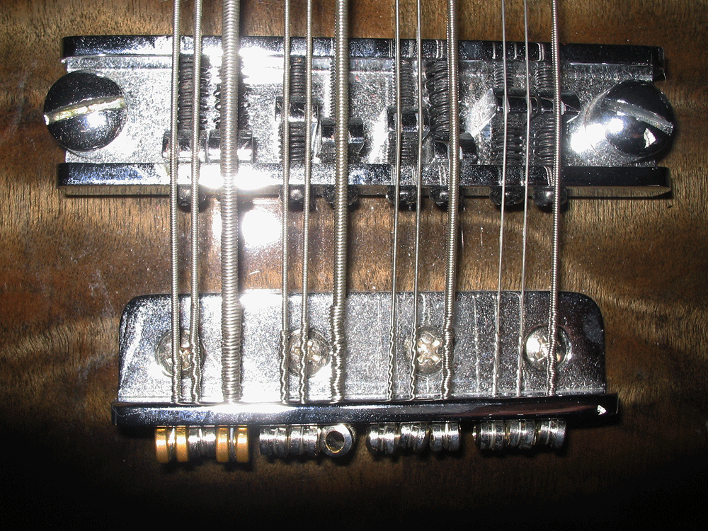 The bridge and tailpiece look to be identical to the hardware used on Hamer 12-string basses.