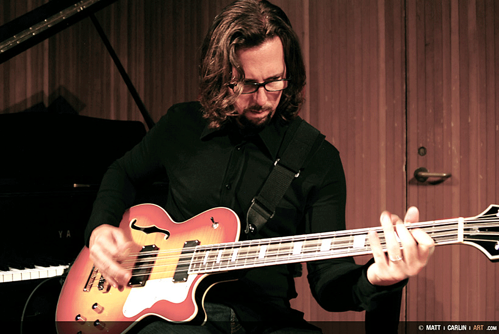 Michael Kelly with his Waterstone TP-12/34 12-string bass.