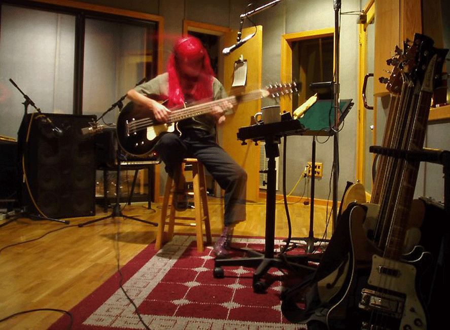 Amy Humphrey in her home studio with her Waterstone TP-1 12-string bass.