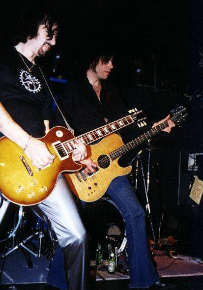 James Hunting on stage with his Hamer B12A 12-string bass and Bruce Kulick.
