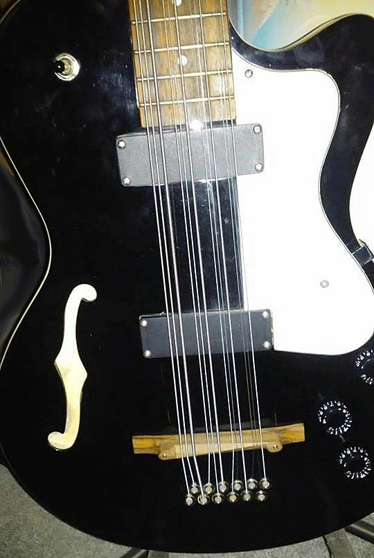 Black finish Starfire 12-string bass. The bridge is a different design and different wood.