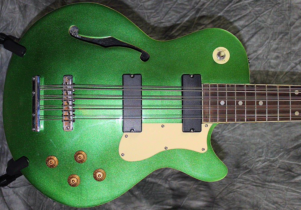 The bass has a slightly arched top. The body is 3½" thick.