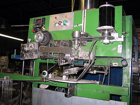 Machine used for attaching ball ends to guitar strings.