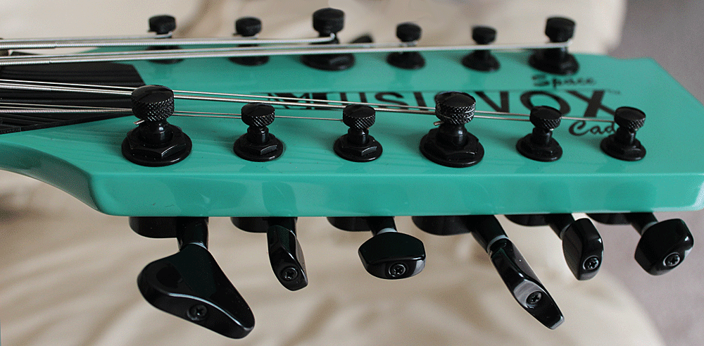 The locking tuners on the first series basses have the locking mechanisms on top of the tuner posts.