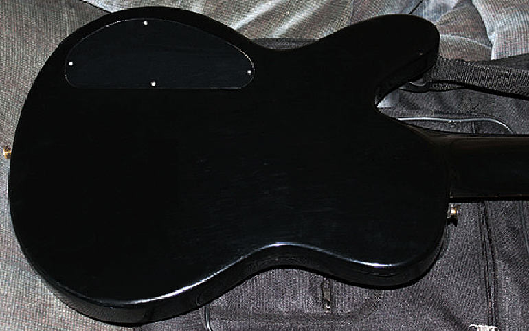 Backs of the First Series Sunburst 12's are all black. The backs of the Second Series basses are in the sunburst finish.