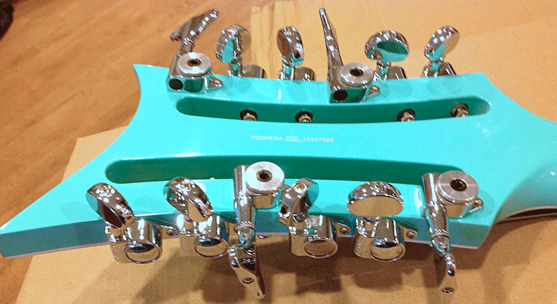 Prototype has locking tuners on fundamental strings.