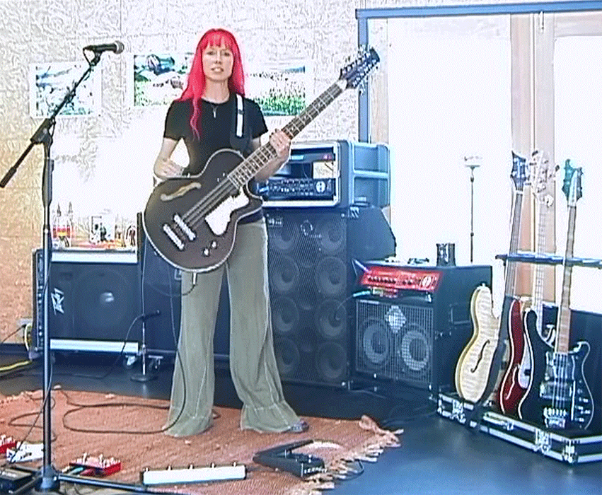Amy Humphrey and her Waterstone TP-1 12-string bass in her home rehearsal / recording studio.