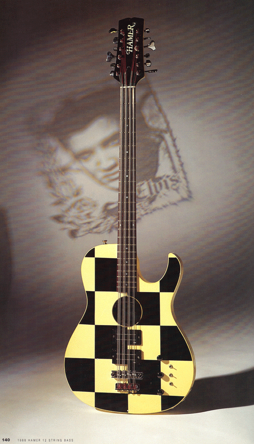 1988 Hamer B12A in the “Elvis” finish, SN# 820501. Per Nielsen, “This stand up checkerboard bass was used in Cheap Trick’s ‘Don’t Be Cruel’ video - it has a removable (screw-in) pool cue for a stand.”