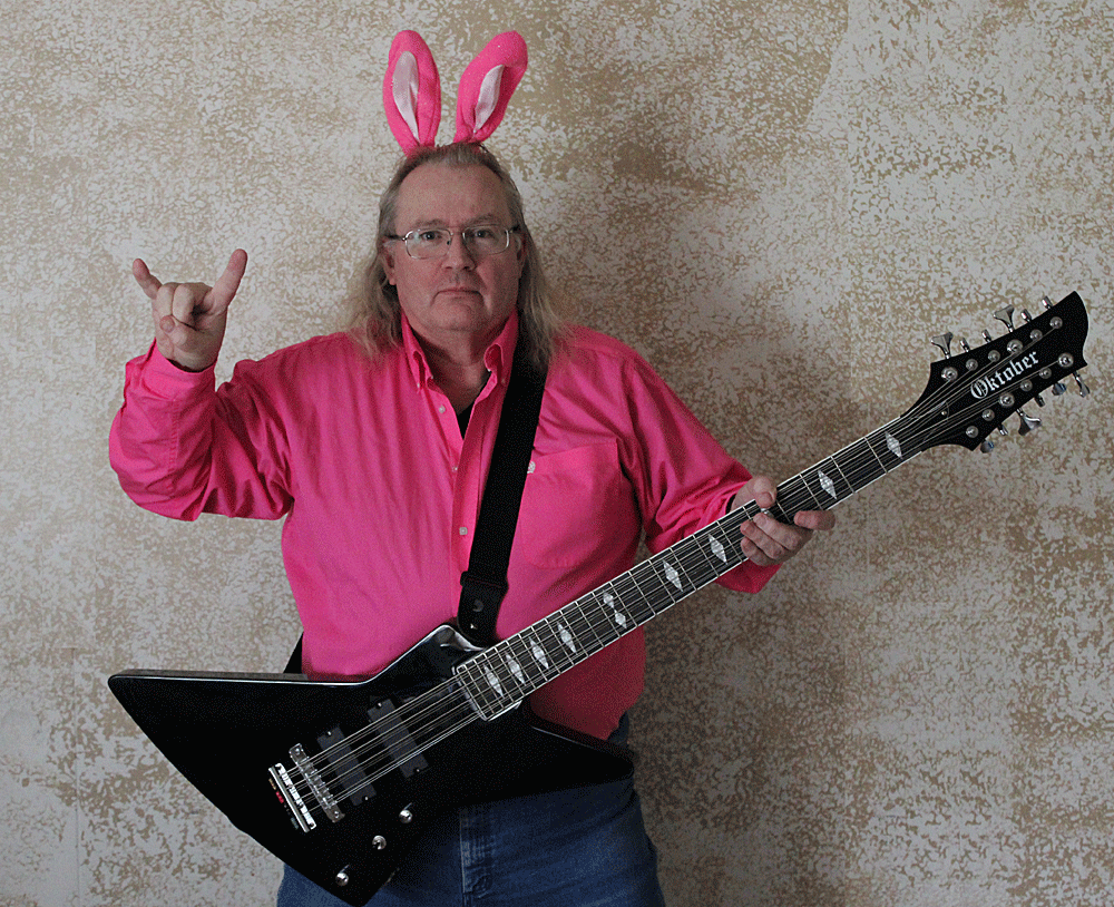Surf with a prototype Explorer-style 12-string bass, strung Inverted. It was built for John Gallagher of the British heavy metal band Raven, but John prefers the Standard string arrangement so he sold it to Surf.