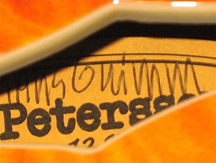 In a few rare instances when the buyer’s name was known to Petersson, he also hand wrote the buyer’s name (in this case “Hans Grimm”) on the sticker in addition to the serial number and his signature.