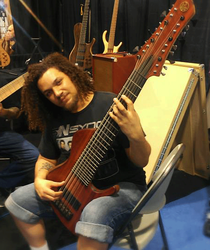 Scott Fernandez with his custom 18-string Prat bass.