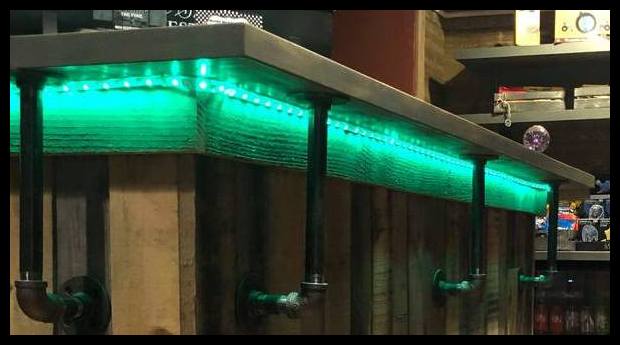  Features like under-mounted custom lighting represent the attention to detail that was put into designing a pleasant lobby for Escape the Pike customers.   