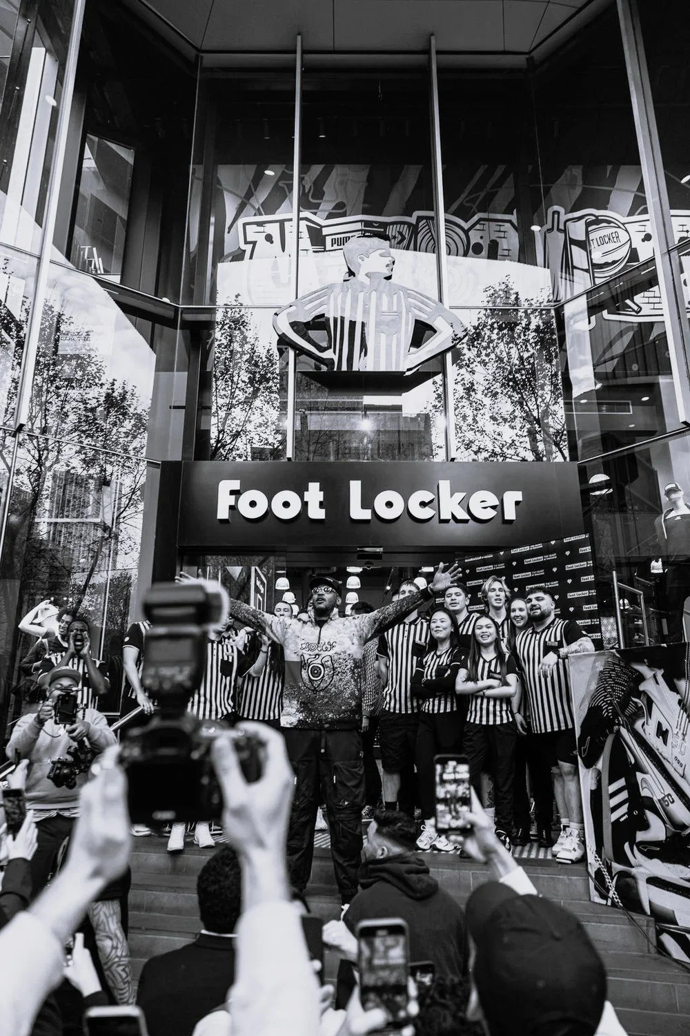 Carmelo Anthony outside a Foot Locker store