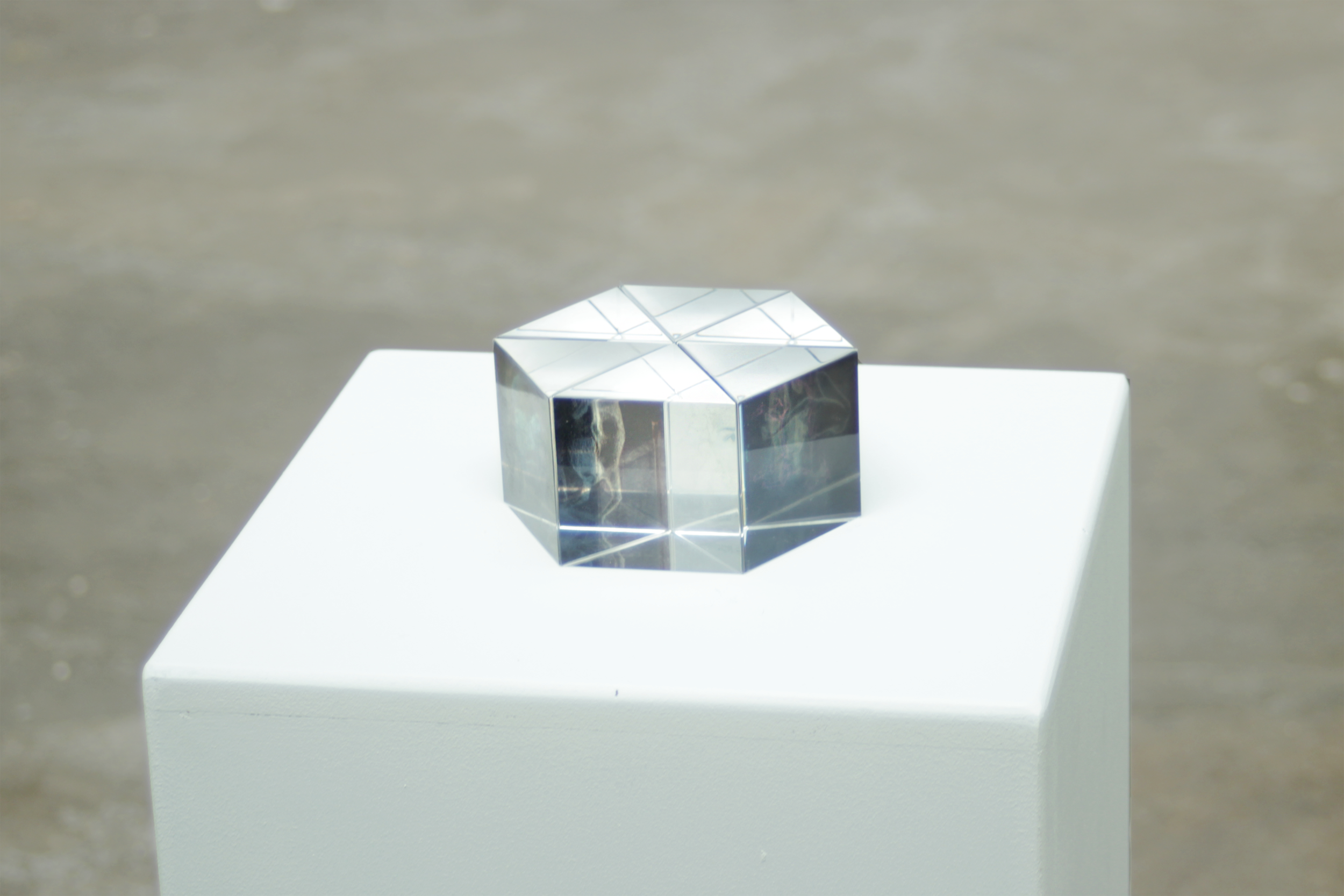 Prism assembly II (installation view 1), pencil drawing prints on acetate and glass prisms, ca. 12 x 5 x 12 cm, 2019-20. See video on the left.
