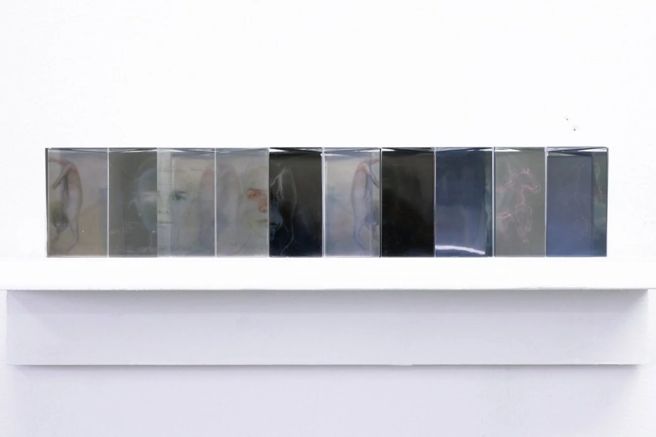 Prism assembly I, pencil drawing prints on acetate and glass prisms (see video), ca. 20 x 5 x 5 cm, 2019. (see video above)