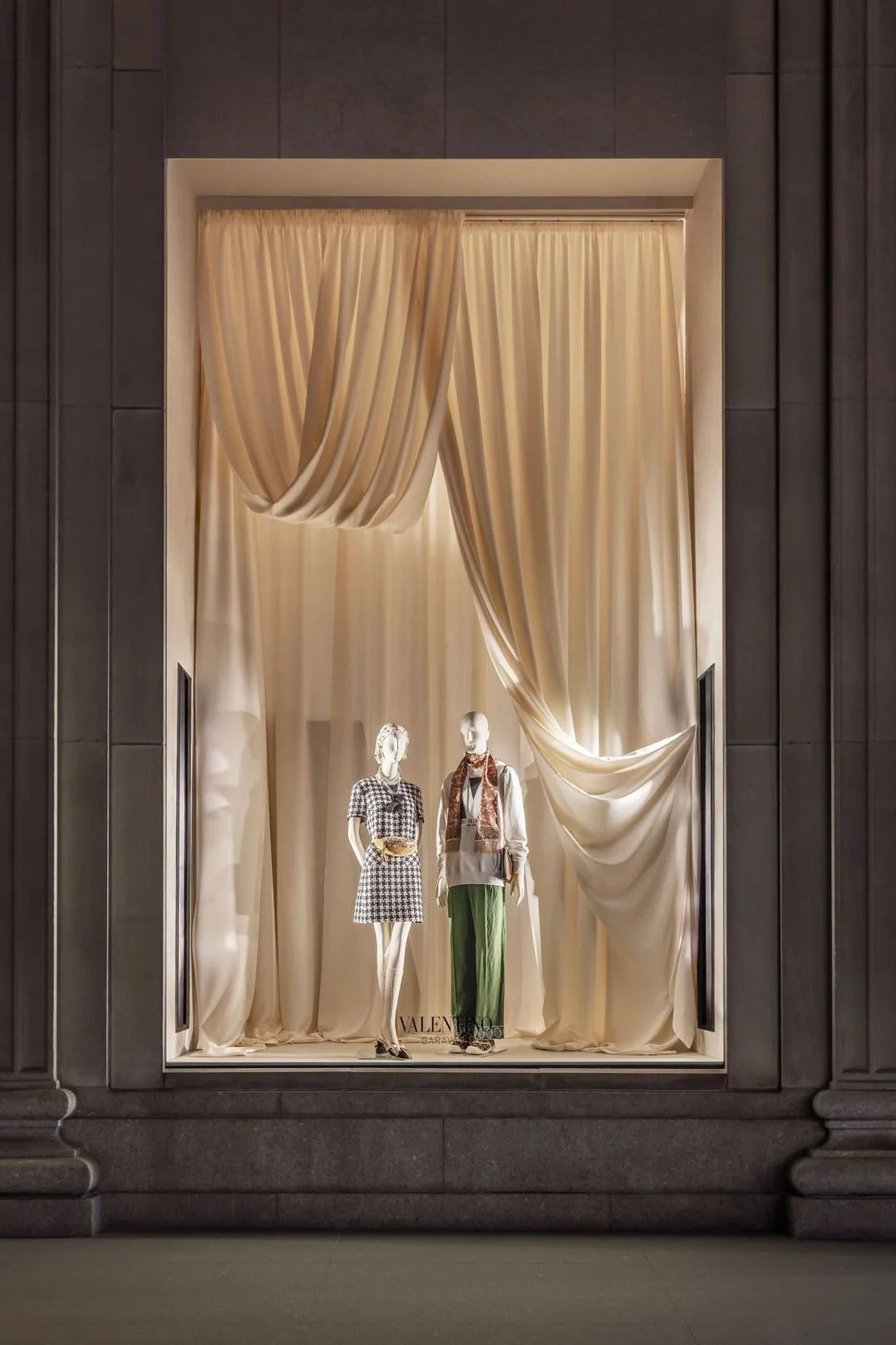 white draping backdrop window display