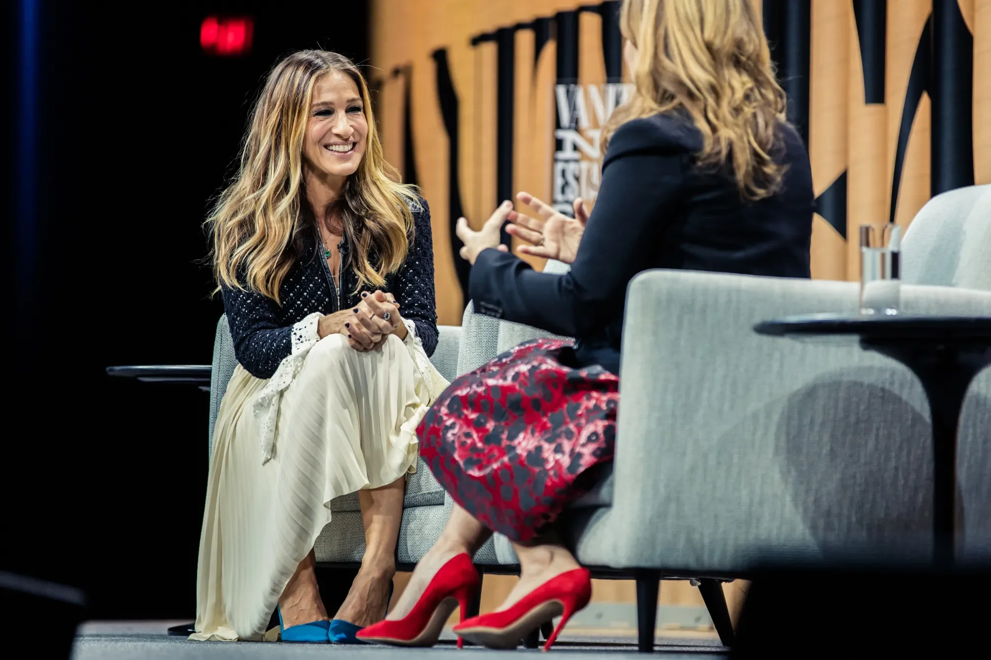 Actress Sarah Jessica Parker engaging in conversation on stage during a panel interview at the Vanity Fair New Establishment Summit.