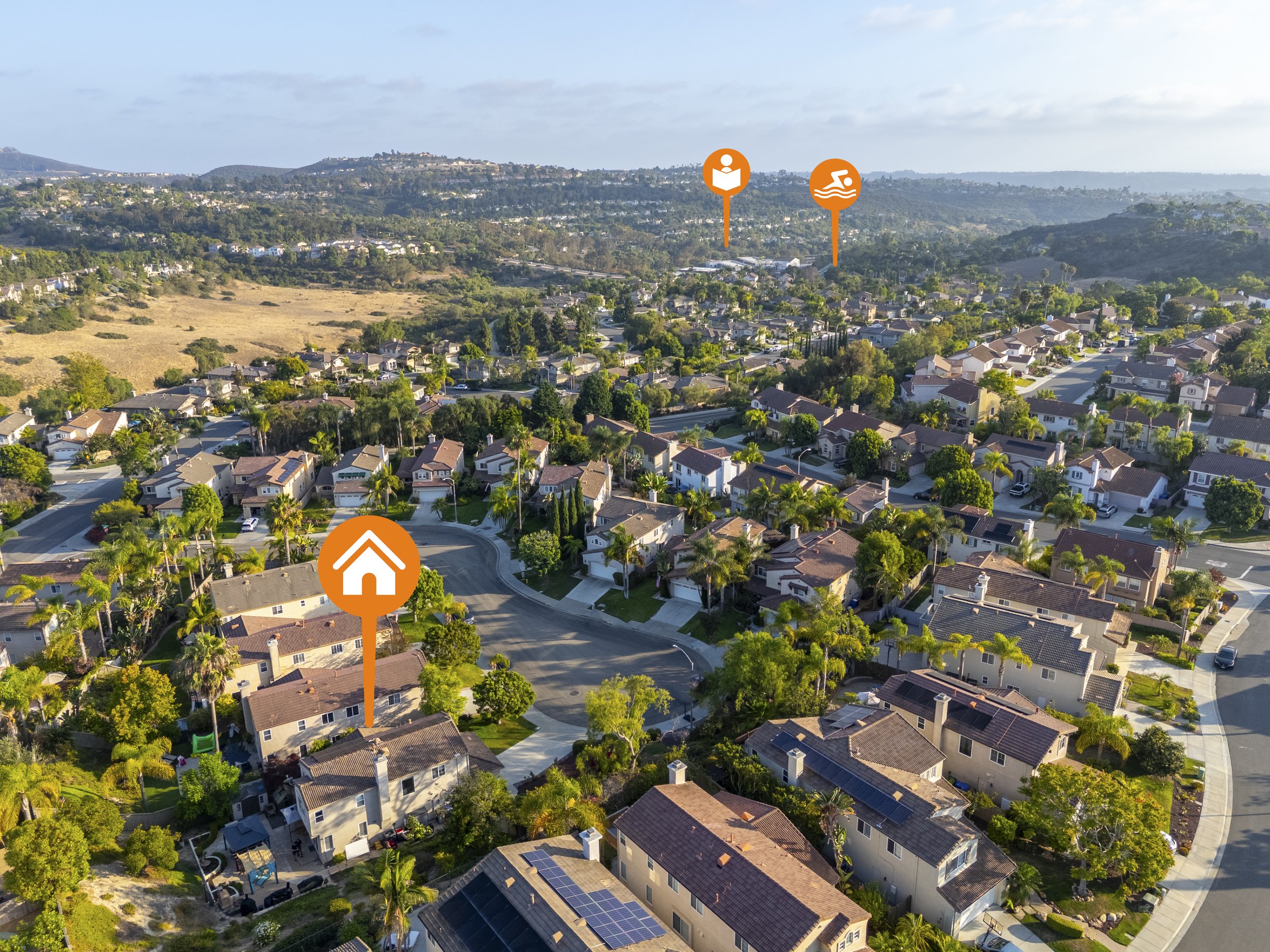 Aerial drone photo of a San Marcos, California neighborhood with a listing marker