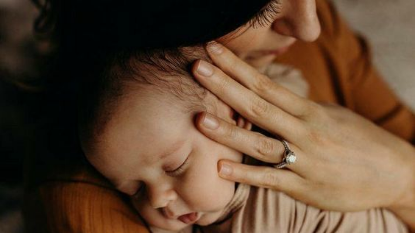 mother and sleeping baby