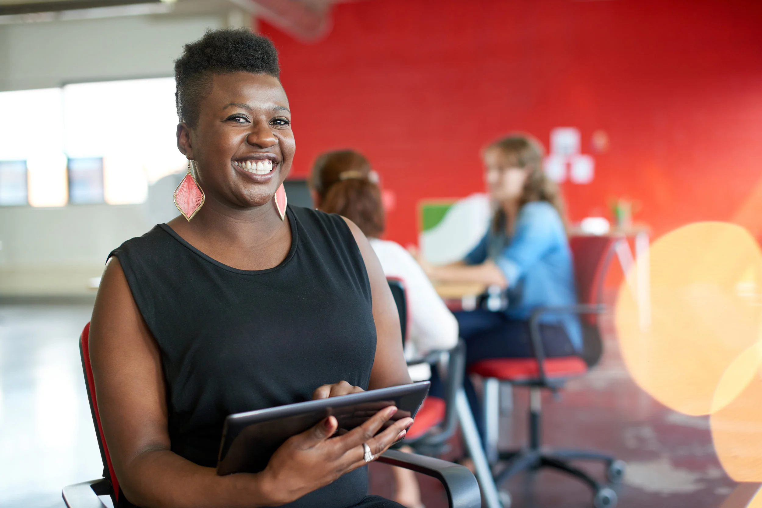 smiling-woman-with-happy-reviews-on-tablet.jpg