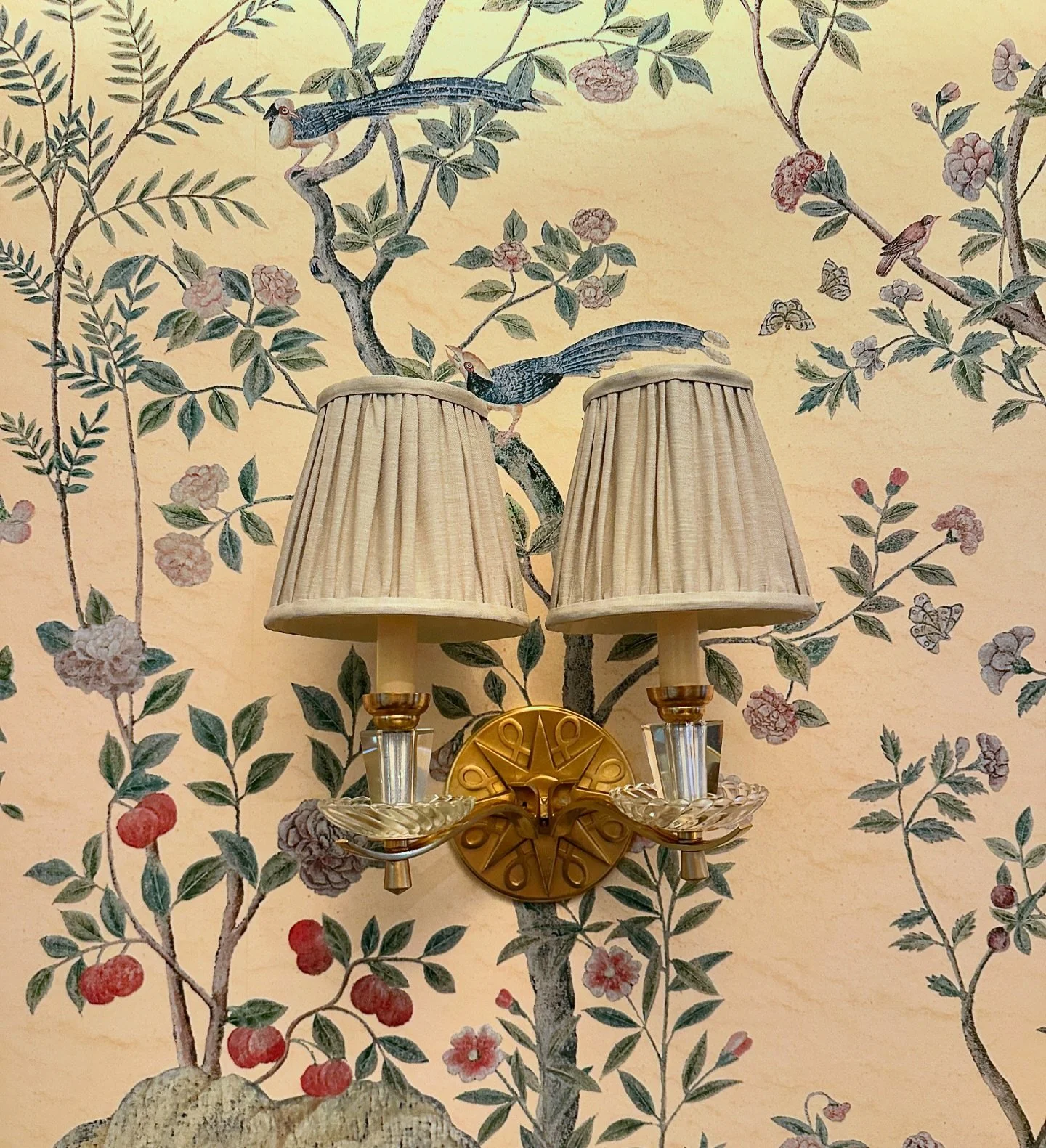 Newly installed Hollywood Regency sconces with silk shades in our Riverside Drive project&rsquo;s ultra glam entry hall! We were very careful to have @iksel_decorative_arts place the birds strategically so as to avoid any decapitations once the light