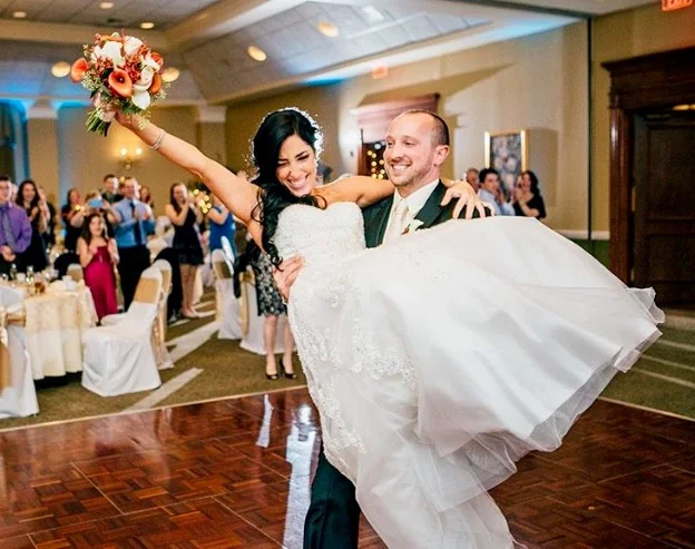 laura swide sweep and groom carrying her.jpg