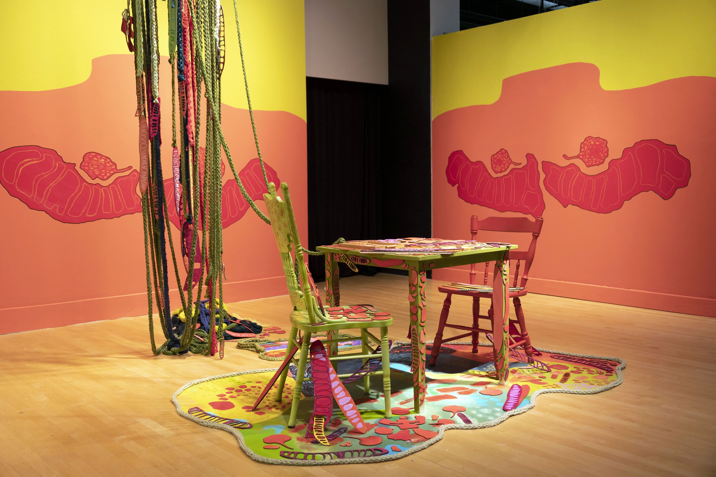 Flamboyán for Breakfast , 2022 Wool yarn, table, chairs, plywood seed pods, acrylic paint, canvas, 20-Minute audio loop of coqui frogs Video Documentation: https://drive.google.com/file/d/1ZEcgBc9PLpkkodoCc3ReWUP3gdDwvOXJ/view?usp=sharing: &nbs