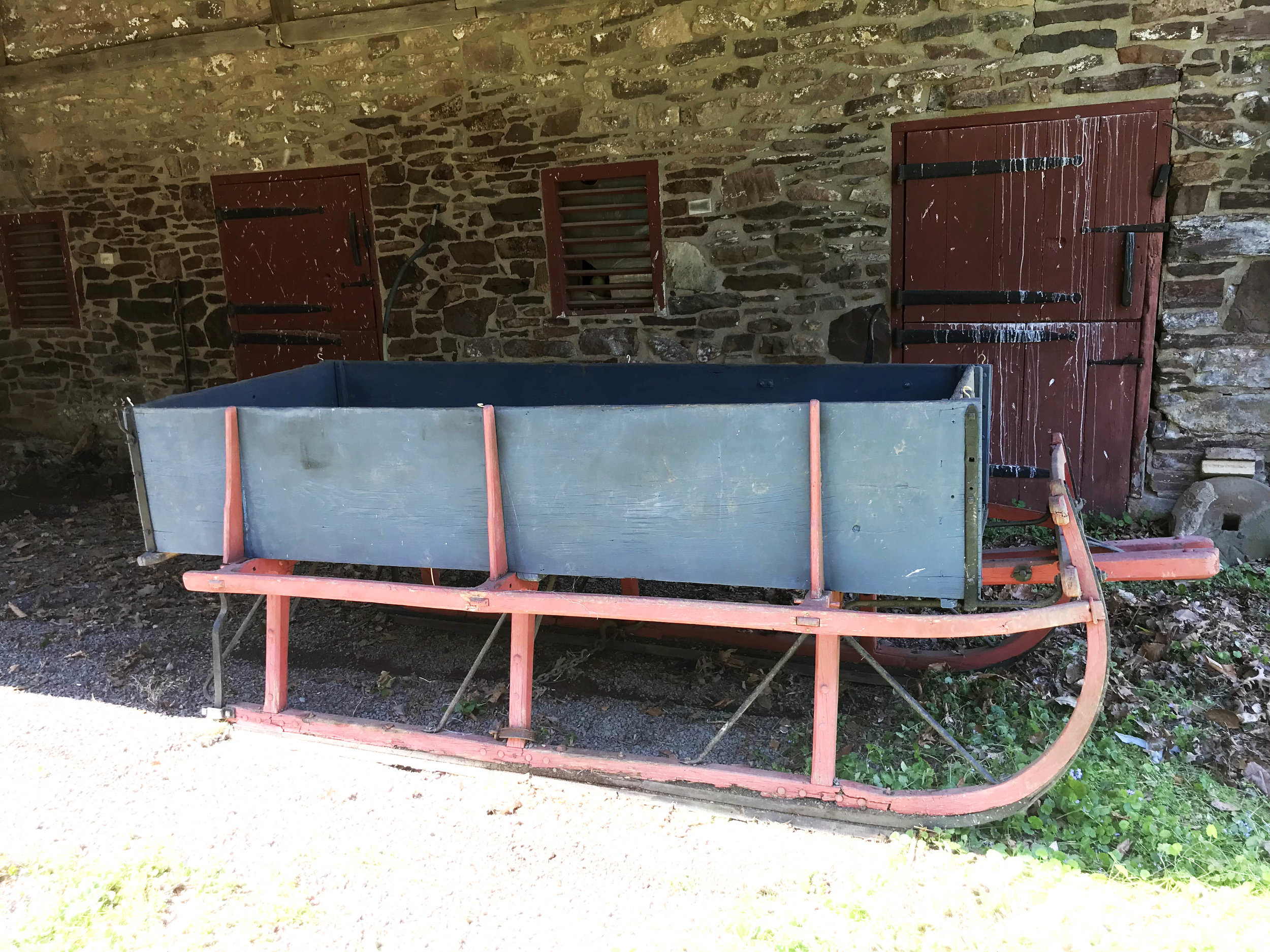 Wooden farm sled in blue paint