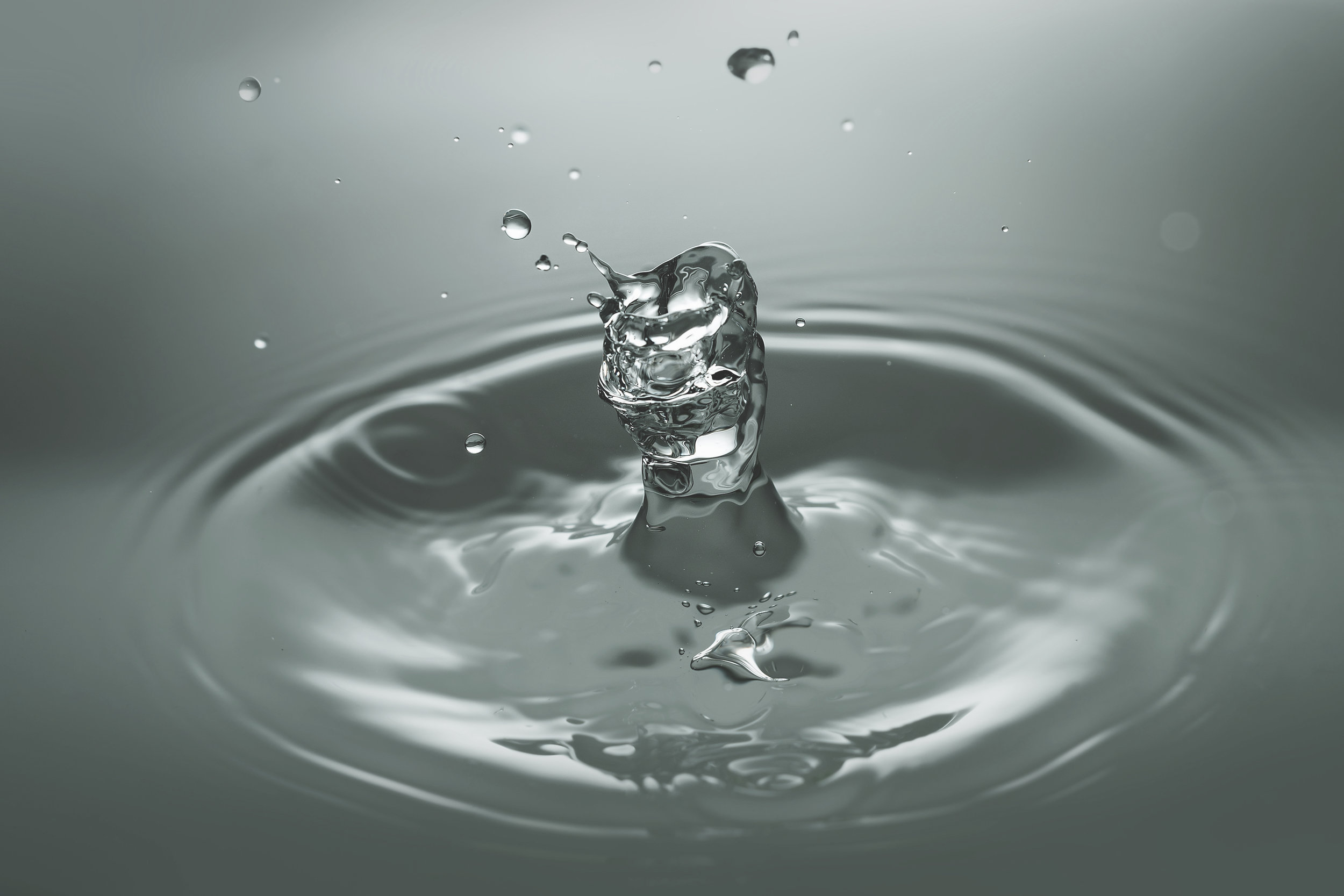 Canva - Close-up of Drop Splashing in Water (1).jpg