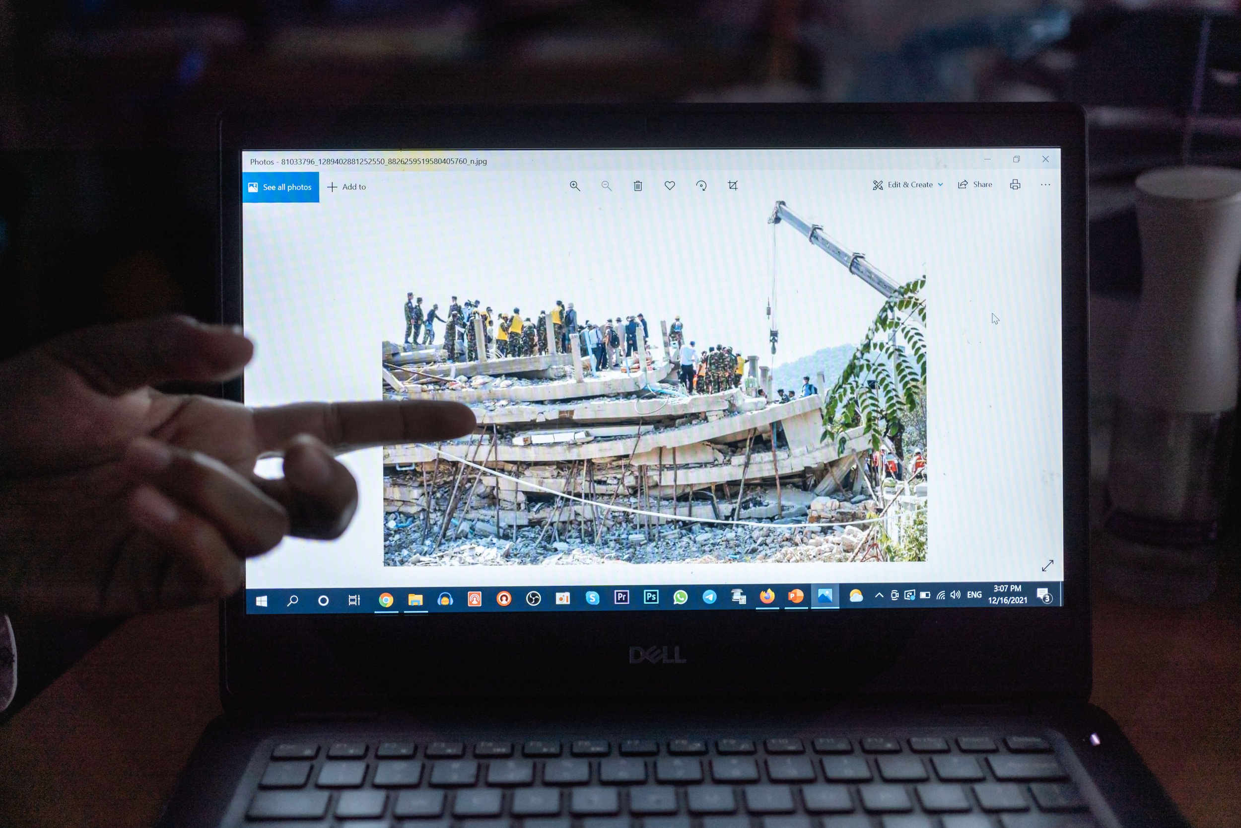  Yann Thy, secretary-general of BWTUC, shows a picture of a building collapse in Kep Province that killed 36 construction workers living onsite on January 3, 2020. Prior to that, two collapses in Sihanoukville and Siem Reap killed 28 and three worker