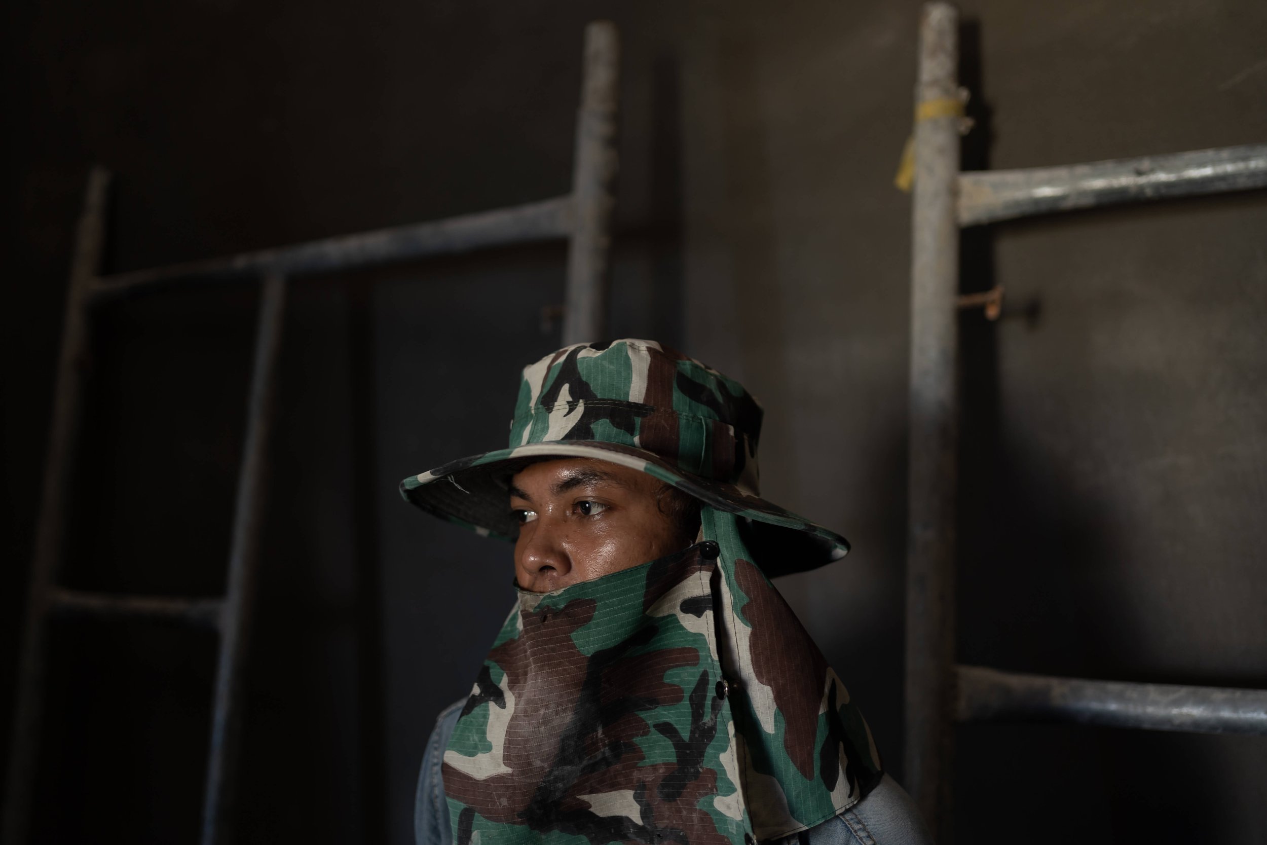  A portrait of Phearum, Ma Srieng’s cousin, at the new construction site he moved to in Phnom Penh’s Kambol district. He quit his job at the Bassac Lane site after 10 days, stating they failed to pay him on time and that the work was too “heavy.” 