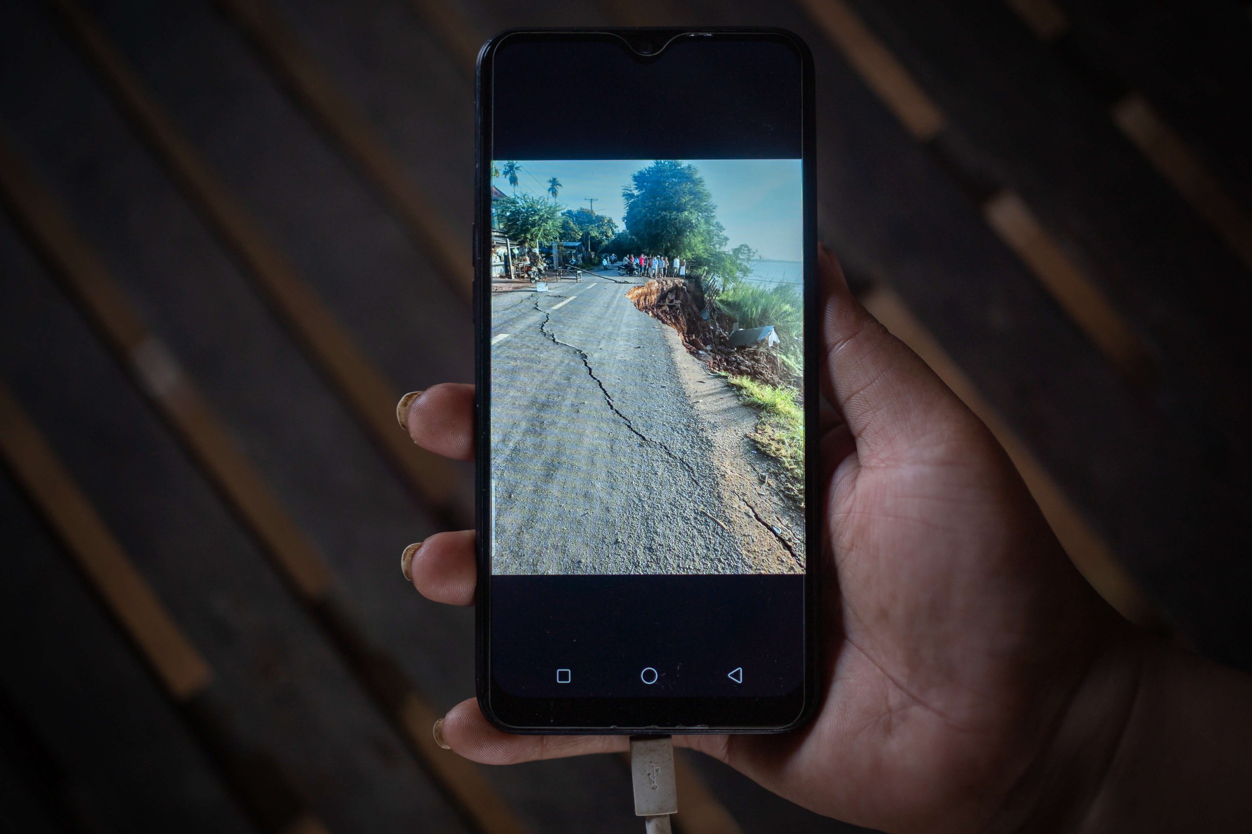  A photo taken by a local on 23 November, 2021, shows a crack that appeared on the main road that passes through Rokar Koang. Although the banks of the Mekong erode naturally and at varying rates driven by the monsoon flood pulse, other research show