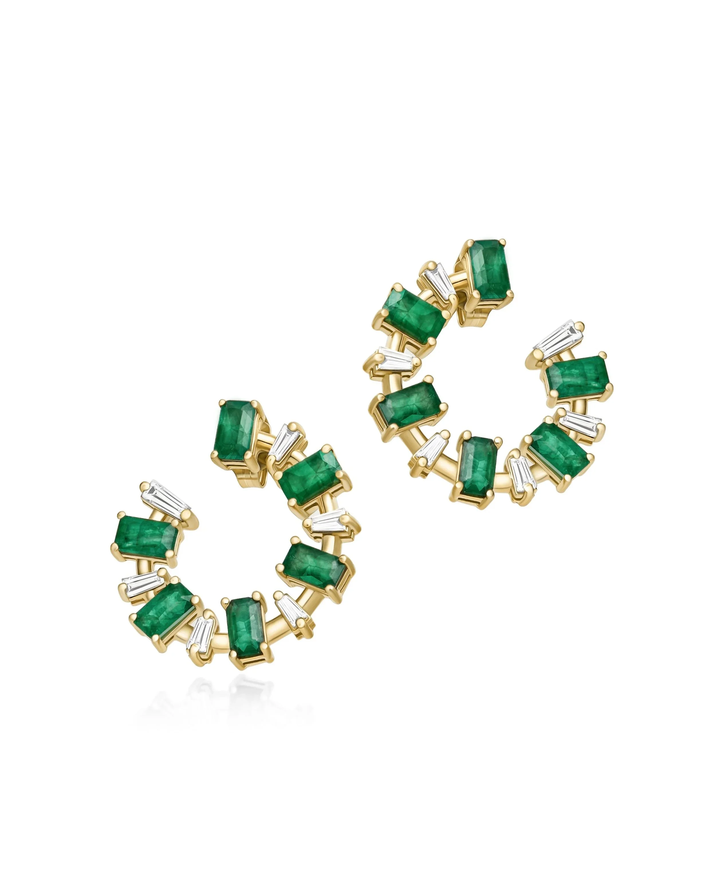 Green-stone and gold-tone earrings on a white background.