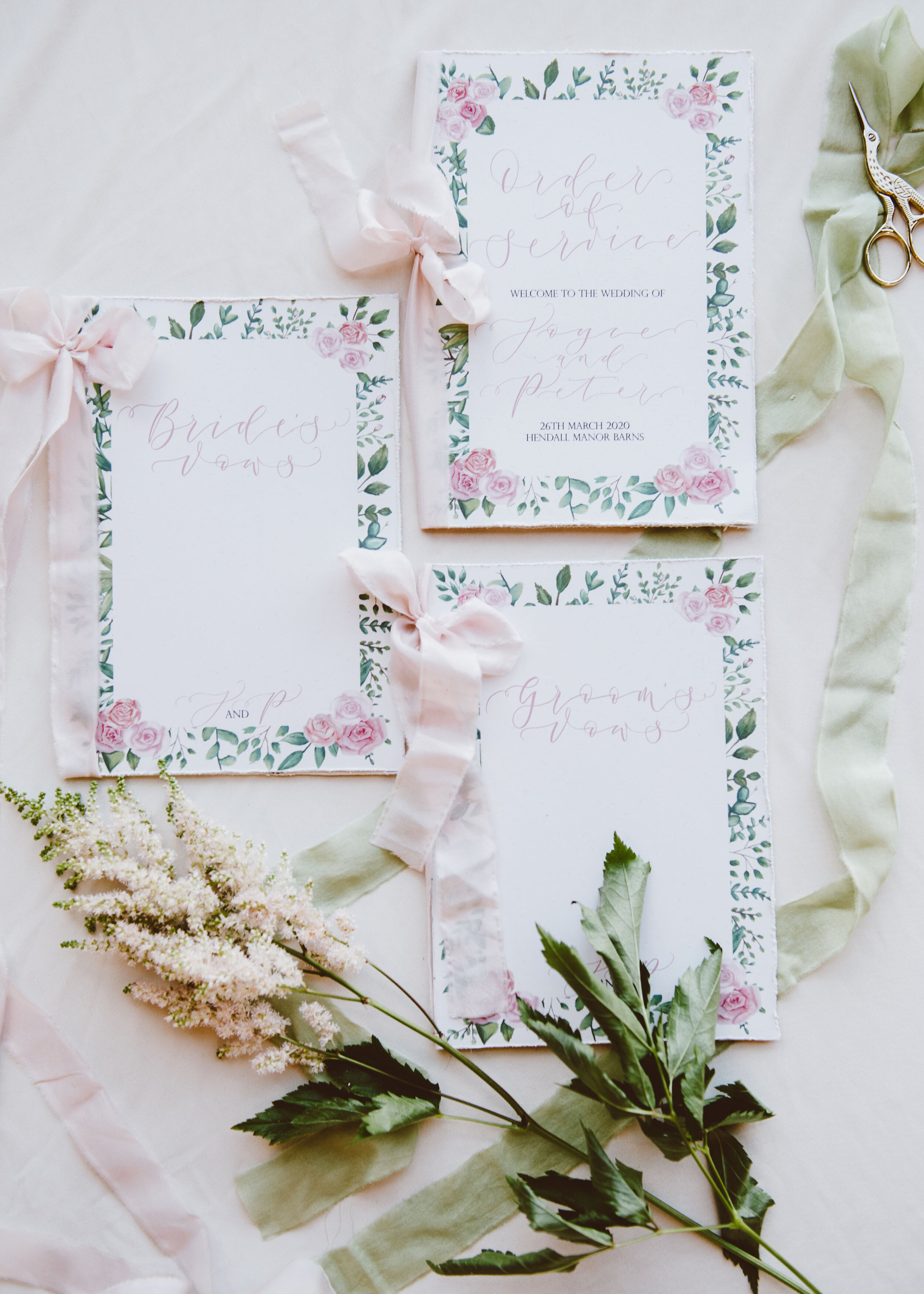 Luxury recycled paper floral vow books and order of service  with pink roses and greenery and hand-lettered calligraphy by The Amyverse - Eco friendly wedding stationery