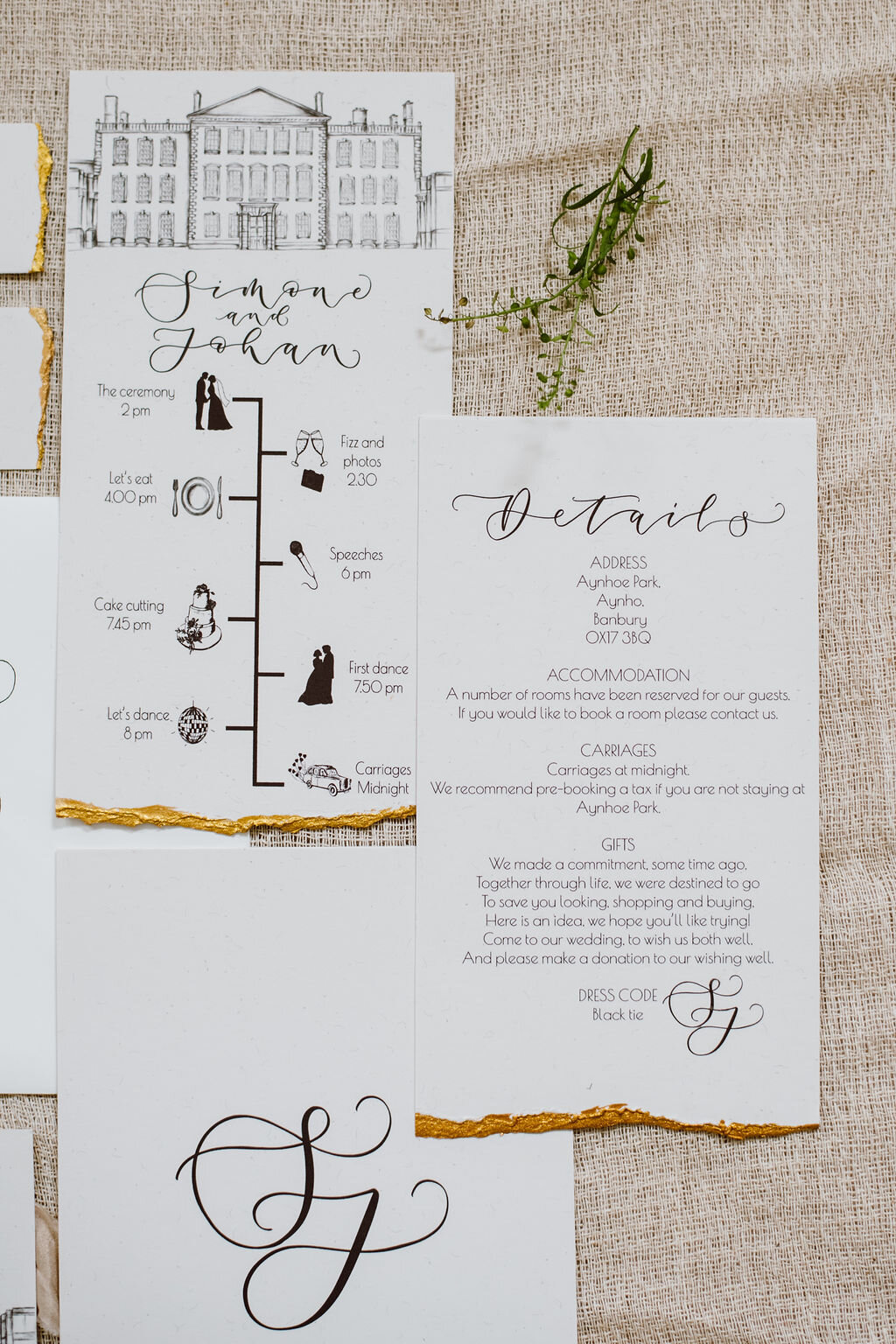 Monochrome Aynhoe Park invitation suite printed on recycled paper with gold details by The Amyverse with illustrated timeline and venue sketch.jpg
