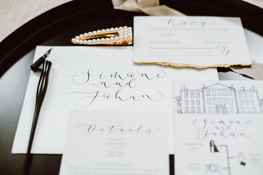 Monochrome Aynhoe Park invitation suite printed on recycled paper with gold details by The Amyverse with illustrated timeline and venue sketch  - calligraphy envelope.jpg