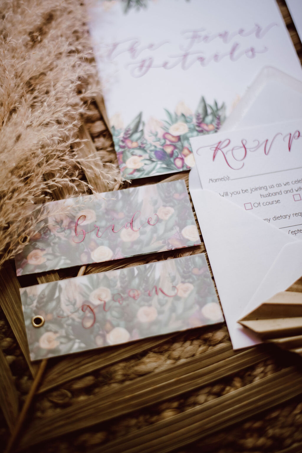 Burgundy calligraphy place cards  on vellum with watercolour painted pampass grass, roses, thistles  - Bride and groom.jpg