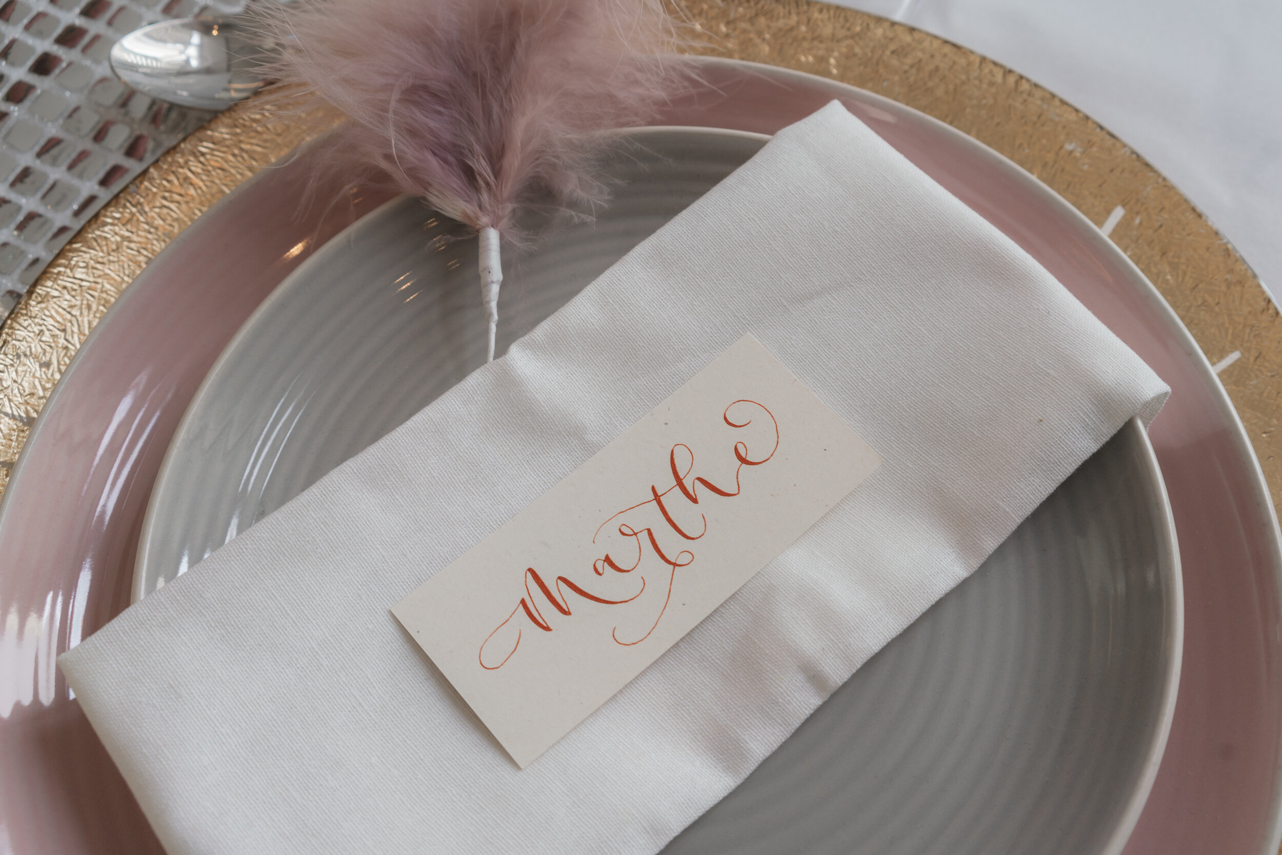 Pink and copper eco friendly wedding stationery created with copper calligraphy ink on flecked recycled paper.jpg