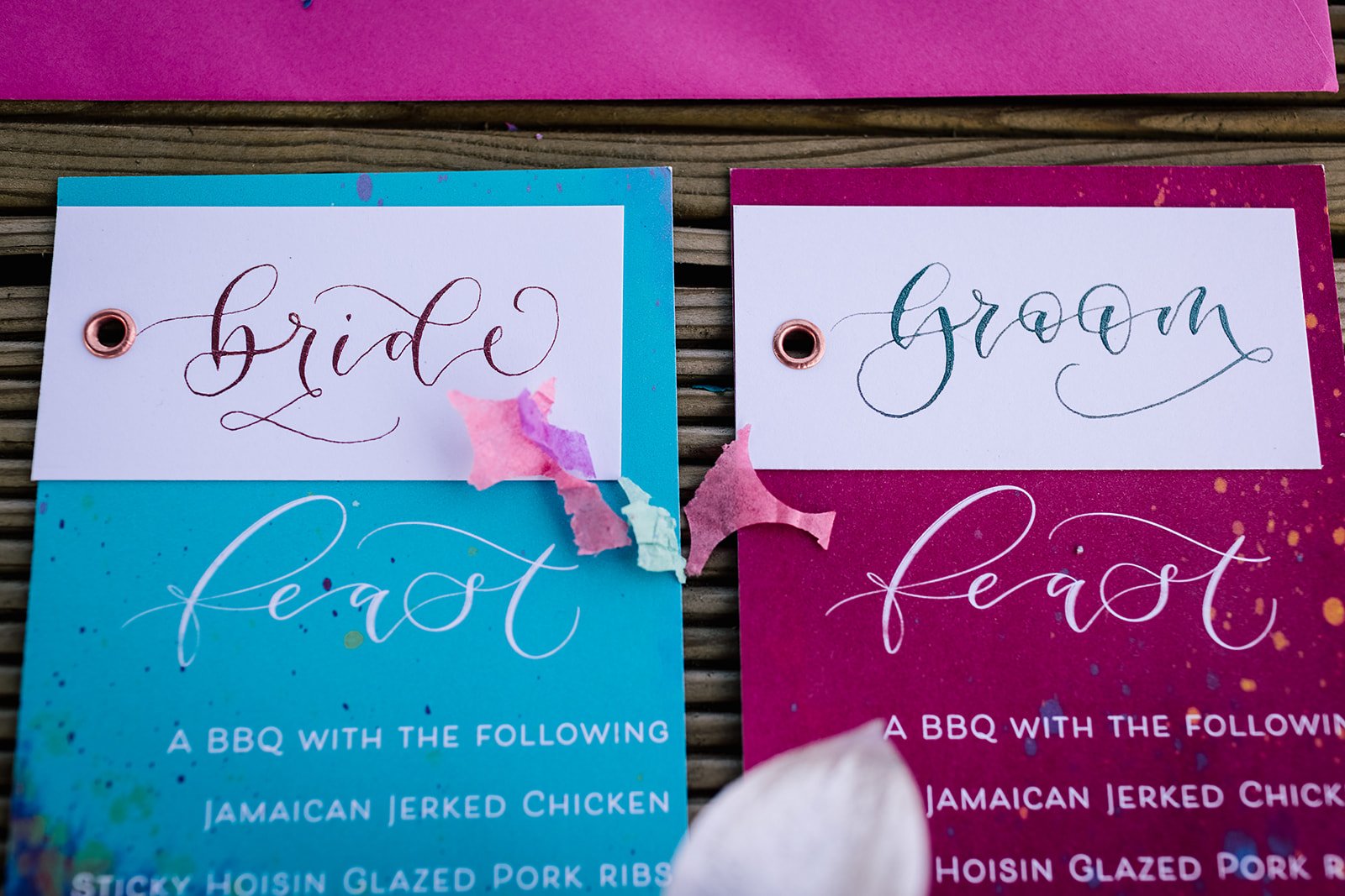 Festival wedding stationery watercolour wedding stationery with hot pink orange and blue,calligraphy place cards and layered menus Bride and groom  combined placecards.jpg