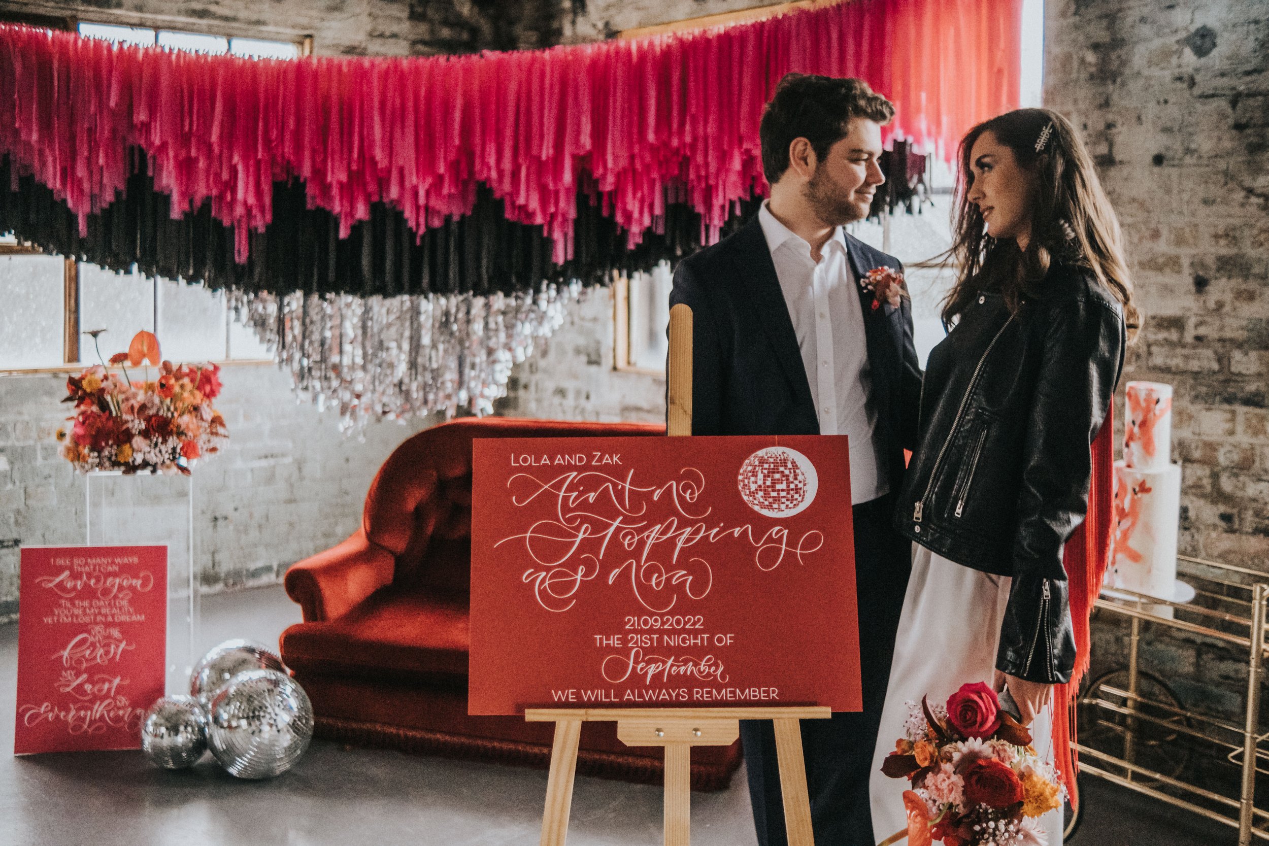 Disco themed wedding stationery with pink, black, grey and red colour scheme - disco ball wedding - calligraphy wedding signage and welcome sign.jpg