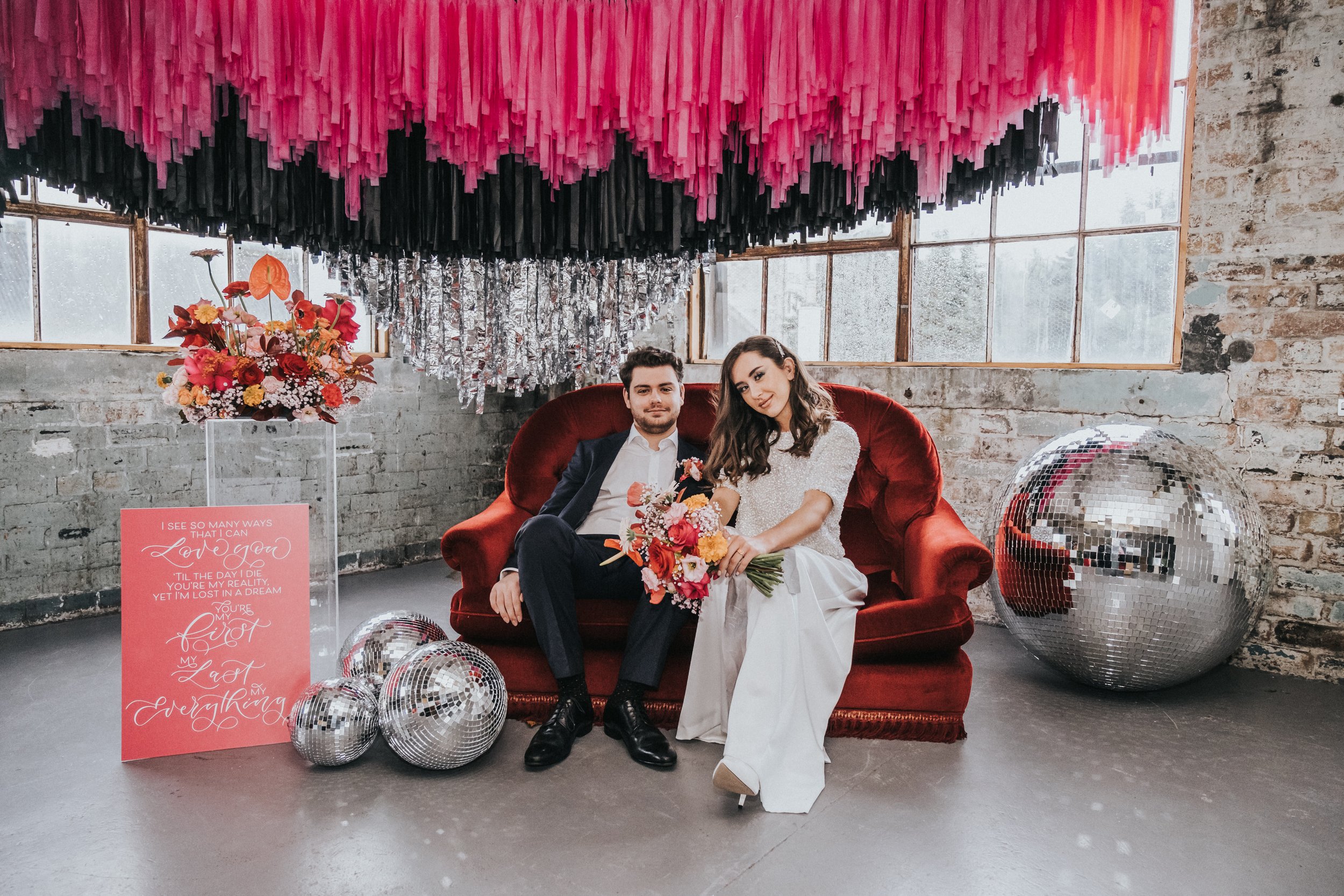 Disco themed wedding stationery with pink, black, grey and red colour scheme - disco ball wedding - calligraphy wedding signage and welcome sign with lyrics.jpg